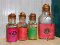 четыре бутылочки с аромамаслами для ванн от целлюлита
